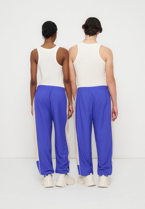 YOURTURN by Zalando RELAXED FIT TECH JOGGING TROUSERS