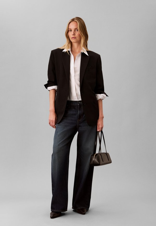 Calvin Klein EMBLEM BAULETTO - Handbag - black
