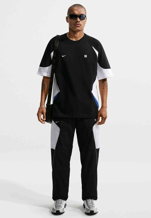 Nike Sportswear NIKE SPORTSWEAR MEN'S WOVEN TROUSERS SPORTSWEAR - Tracksuit bottoms - black white