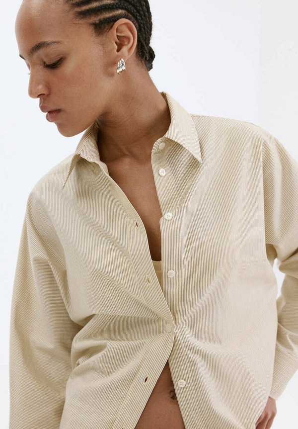 Mango ADULT - Button-down blouse - light yellow