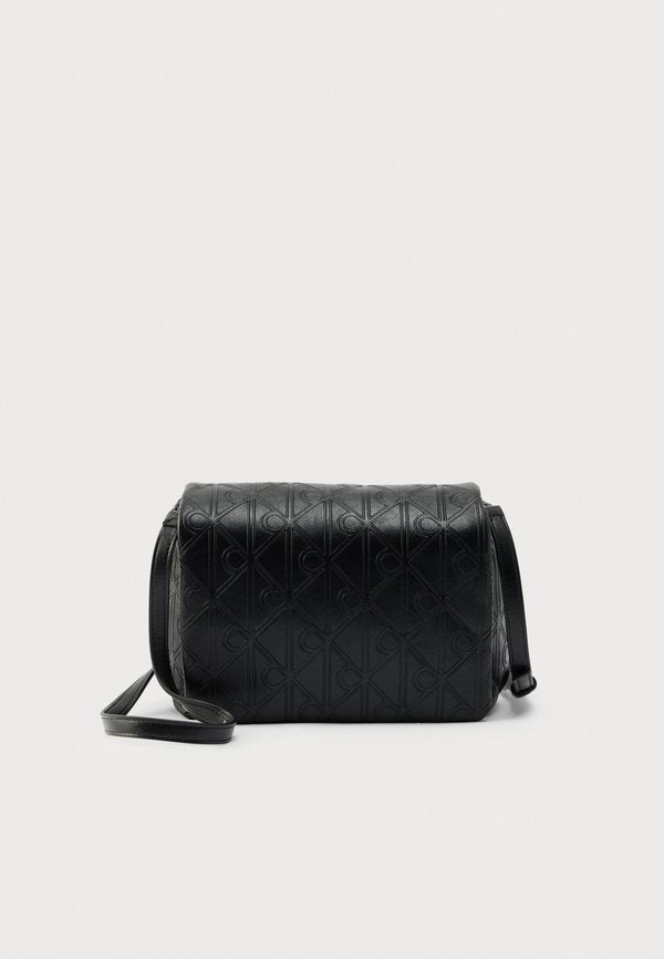 Calvin Klein EMBLEM PUFFER FLAP - Cross body bag - black