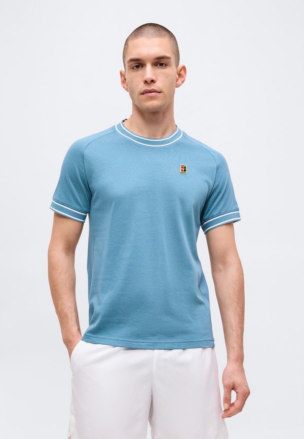Nike Performance HERITAGE - Sports T-shirt - smokey blue