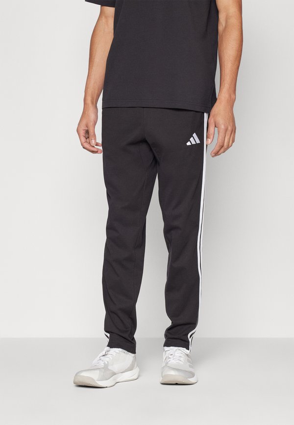 adidas Sportswear Tracksuit bottoms - black/white