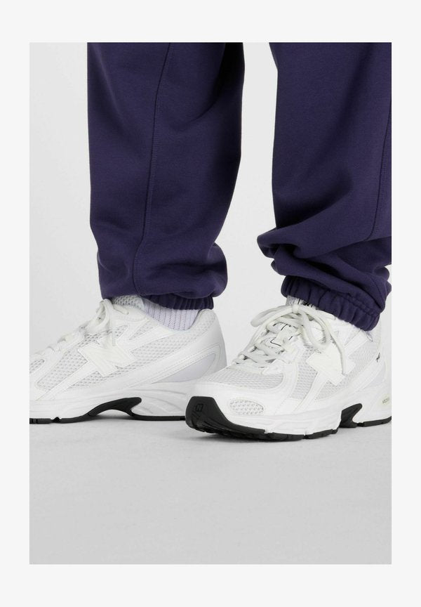 New Balance ATHLETICS FRENCH TERRY  - Tracksuit bottoms - boysenberry