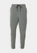 Nike Performance UNLIMITED - Tracksuit bottoms - smoke grey/black/reflective silver