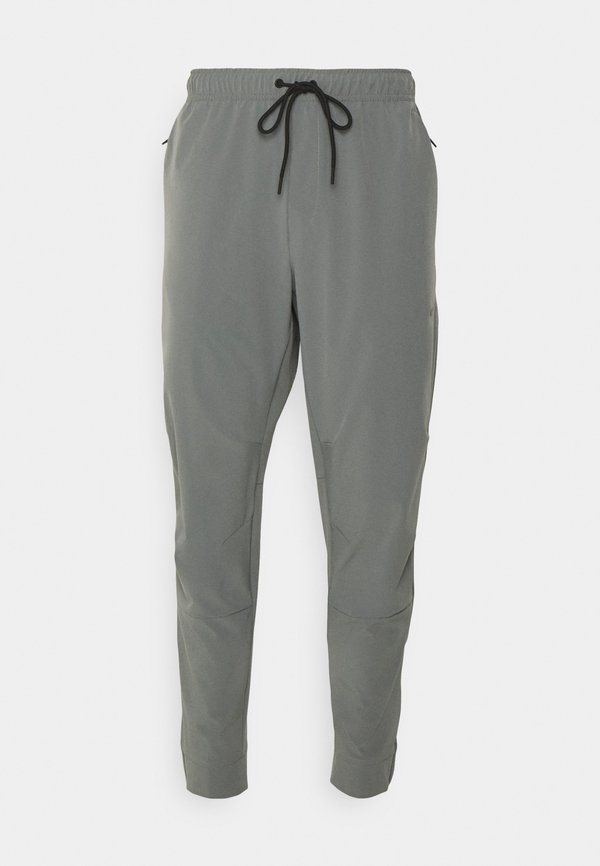 Nike Performance UNLIMITED - Tracksuit bottoms - smoke grey/black/reflective silver