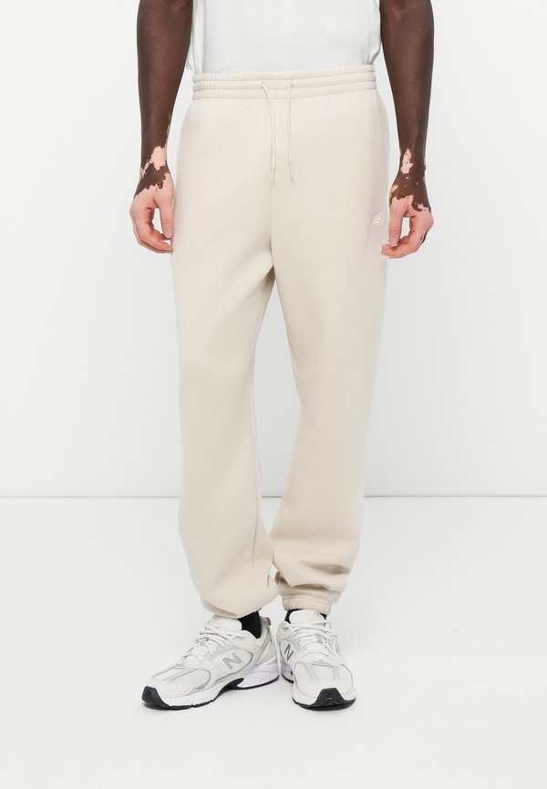 New Balance SPORT ESSENTIALS JOGGER - Tracksuit bottoms - grey