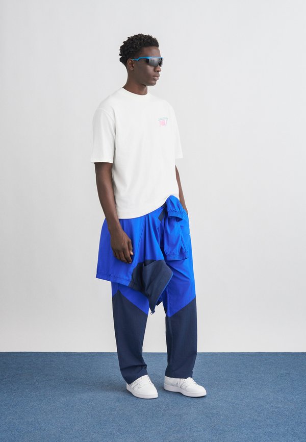 New Balance SPORT LEGACY PANT
