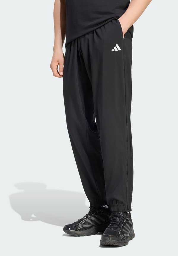 adidas Sportswear Tracksuit bottoms - black/white